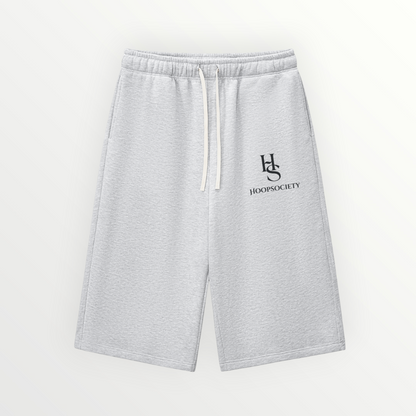 HoopSociety Baseline 3/4 court shorts in grey heavyweight cotton-blend with drawstring waist and HS logo branding.