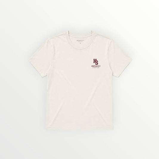 HoopSociety Grace in the Grind relaxed tee in cream cotton with a small maroon front logo